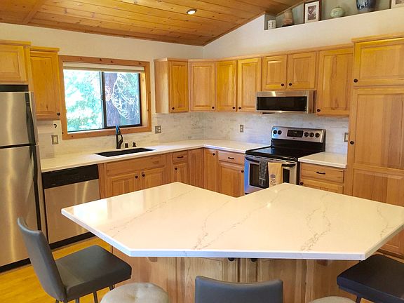 Fully furnished with all the basics and more. Silverware, plates, bowls, coffee mugs, glasses, cooking utensils, coffee pot, electric kettle, toaster, blender, pots/pans/baking sheets and items, mixer, chopper, sandwich press, crockpot, and BBQ utensils.