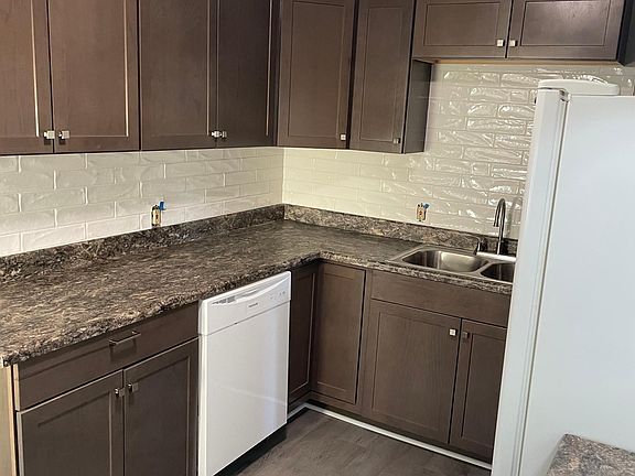 completely new kitchen cabinets, countertop and subway tile. NEW dishwasher and stove.