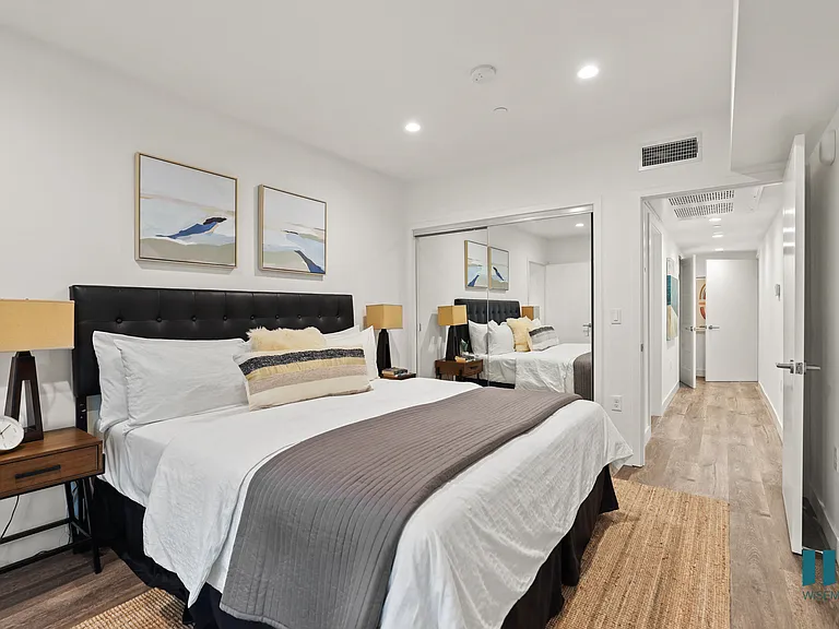 Bedroom with Mirrored Closet, Vinyl Flooring, and Recessed Lighting