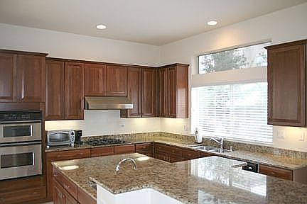 Kitchen with gorgeous cherrywood cabinets and 18" tile floors