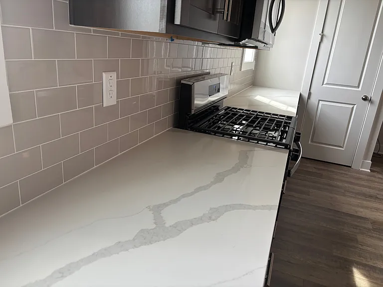 Plenty of counter space with tile backsplash