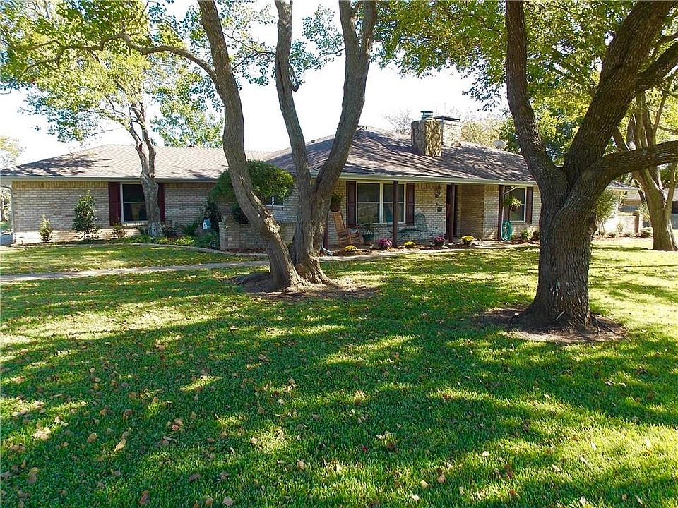 Beautifully landscaped with mature trees. Welcome Home!