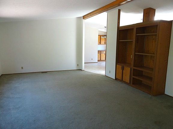 The living room is quite large.  This great bookcase is a great addition to the room.  