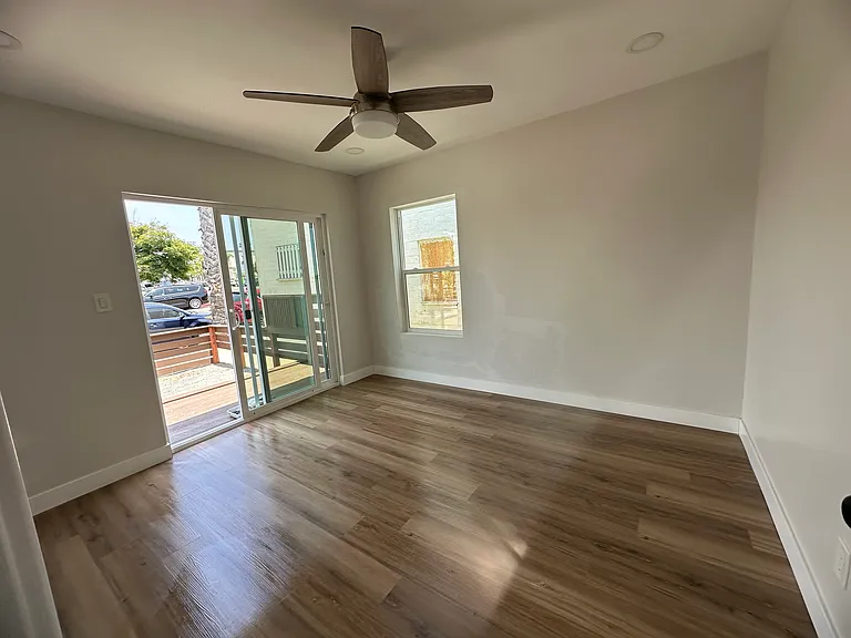 Front bedroom has a slider that leads to the deck outside.