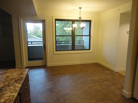 Dining area with door to private balcony, room for table/cha