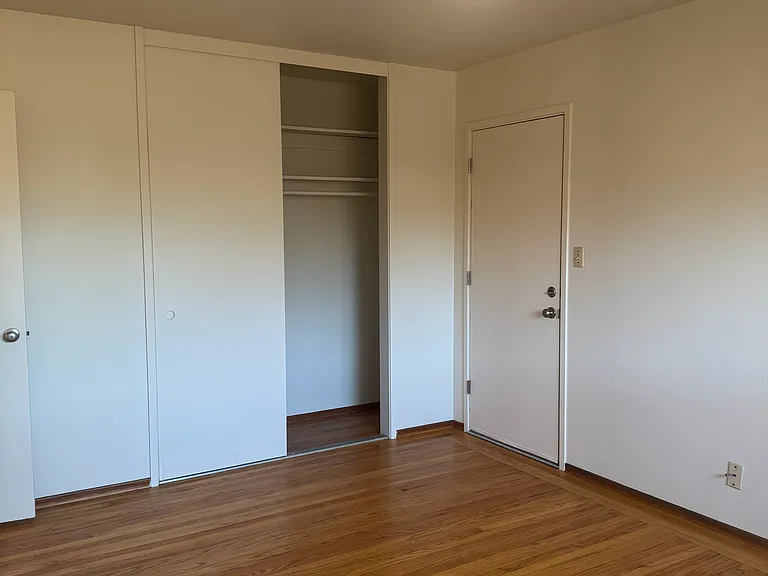 Primary bedroom with backyard access