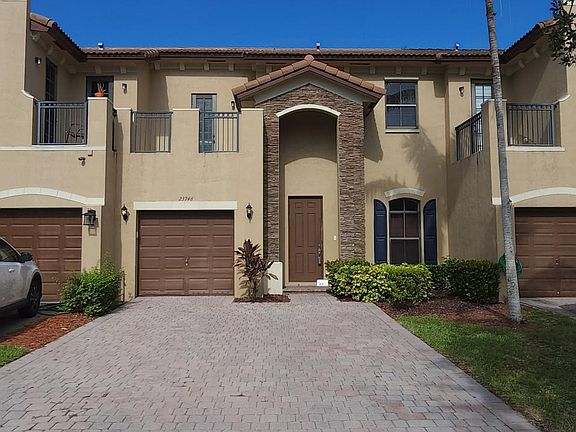 Front of home view with 4 car driveway.