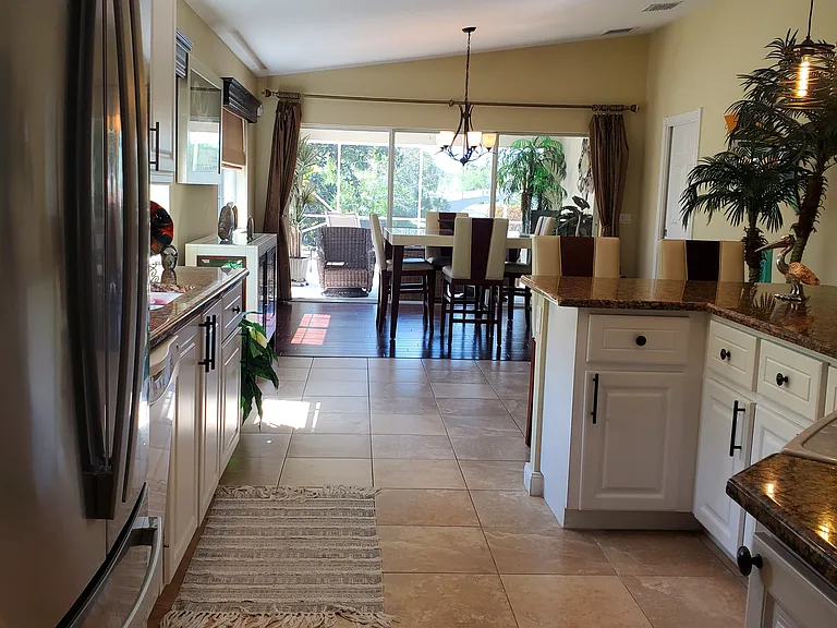 View from kitchen through dining room to patio