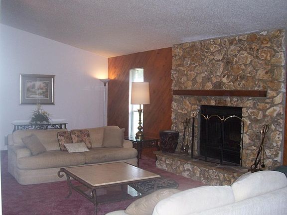 Great room stone fireplace side