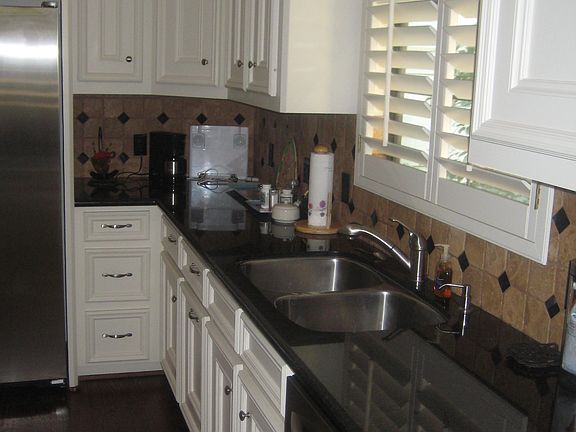 Custom cabinets, black granite counters, all stainless appliances.