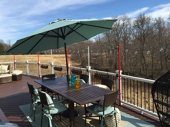 Relax on the massive 450+ sq ft Trex deck featuring sweeping, completely unobstructed views of the preserved woodlands.