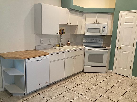 Kitchen includes dishwasher and microwave.