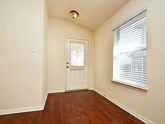 Entry with beautiful door.