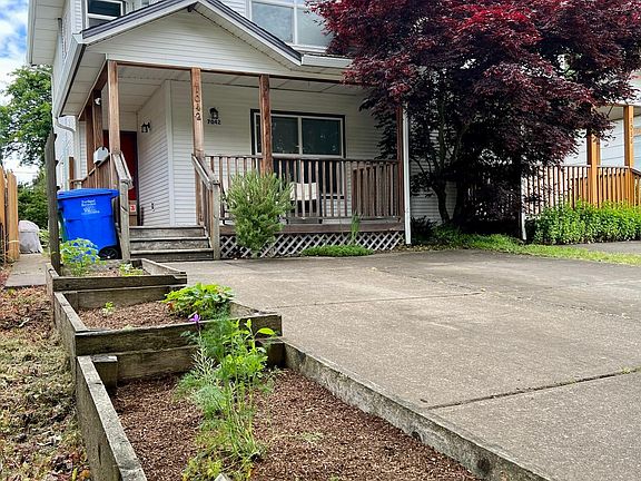 TWO off street parking spaces and garden beds.