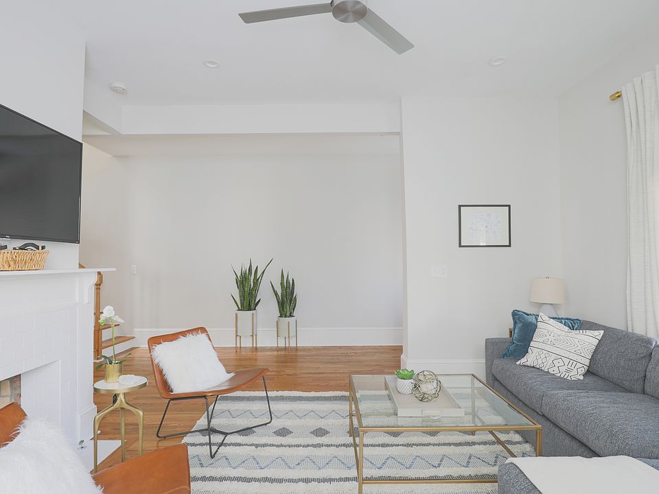 Living Room (Photos shown with staging for layout reference _ unit offered unfurnished.)