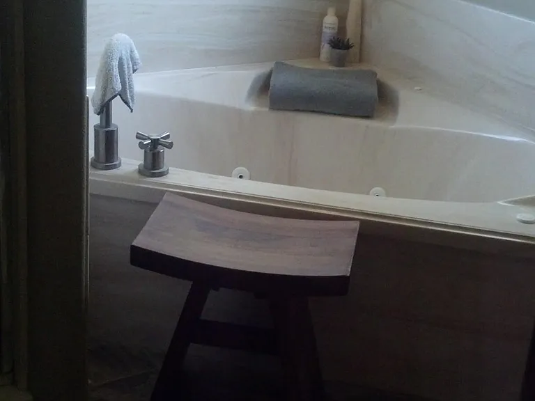 Master jacuzzi tub and flagstone floors.