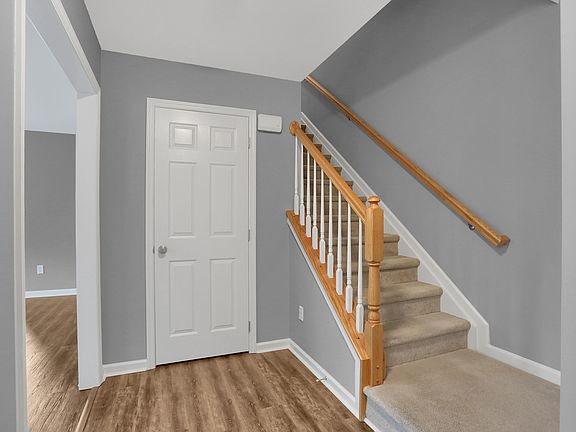 Entrance with coat closet and powder bathroom