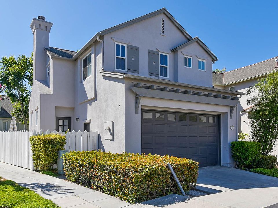 The back of the house with two car attached garage.