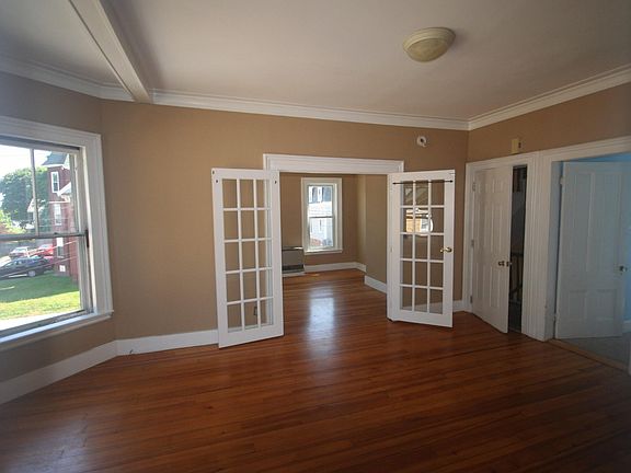 Large dining or living room. Bay windows.