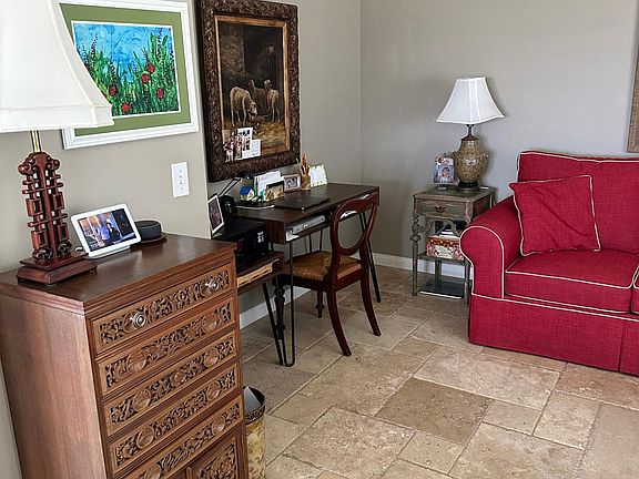Travertine tile floor throughout expect bedrooms.