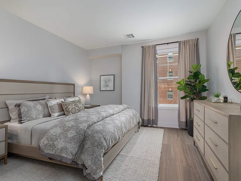 Experience serenity in this elegant bedroom, perfectly blending style and comfort.