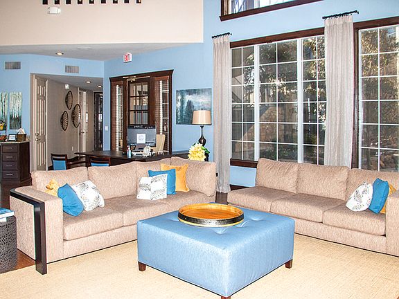 Clubhouse interior lounge with comfortable seating and natural light