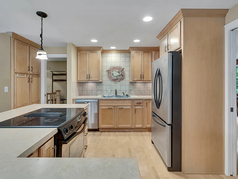 Very nice kitchen with lots of cabinets and modern convenience.