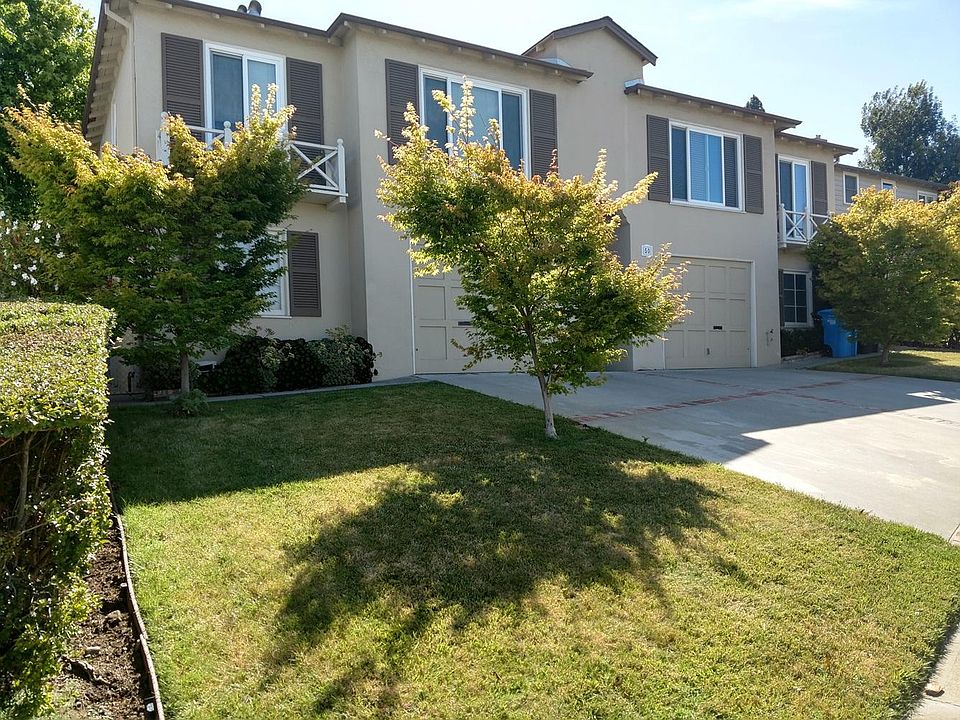 Units 50 and 52. 50 is at the right. Window above garage is kitchen. Window to the far right is living room.