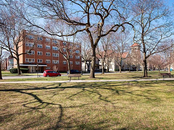 Rarely available sun-filled corner unit with incredible views of Raymond Park!