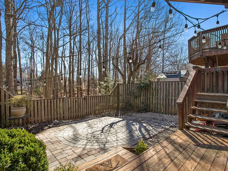 View of paver patio garden area from lower deck