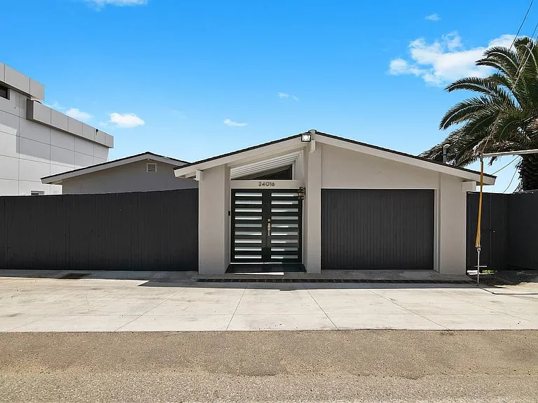 The front of the villa with two parking spots.