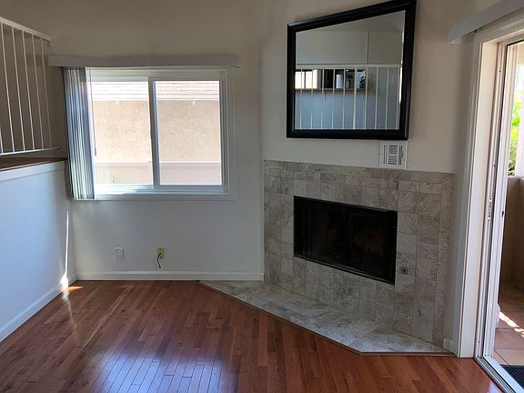 Lower living area (or office area) with slider to lower balcony. Fireplace is no longer serviceable.