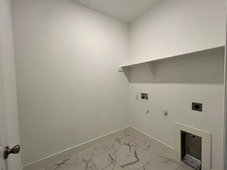 Oversized separate laundry room.