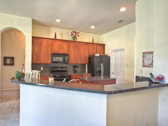 Kitchen is open to den and breakfast area