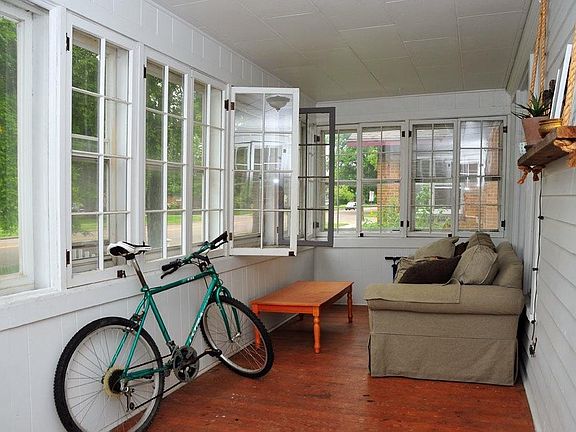 Inviting Enclosed Front Porch for Relaxing
