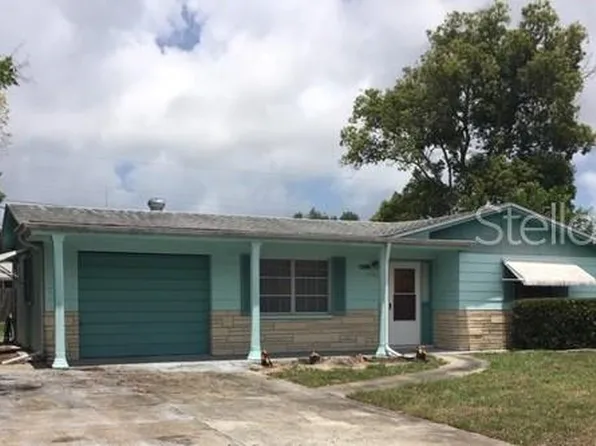 1243 Honor Dr, Holiday, FL 34690
