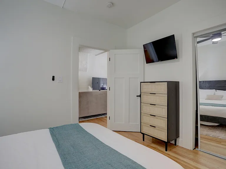 Second bedroom with queen bed and smart tv