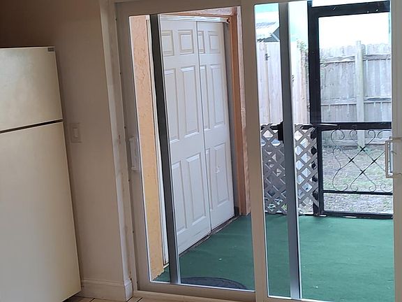 Your living room leads into your kitchen and private screened in patio