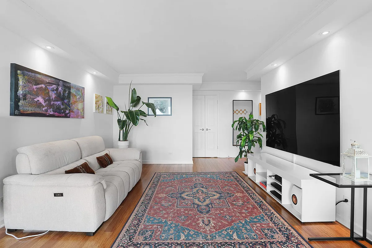 Reclining sofa, 75" flat screen TV - 4466 W Pine Blvd