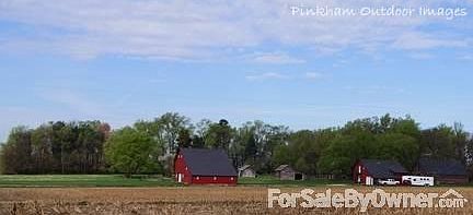 House and Corn Crib View
						:
						Corn crib has lights for working on equipment all hours and concrete floors.