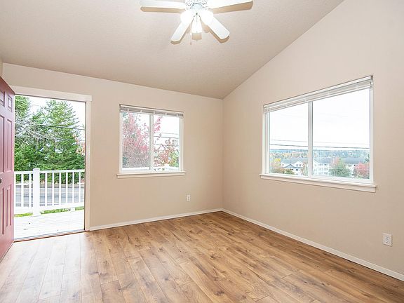 Living room with door to the balcony - overhead ceiling fan.