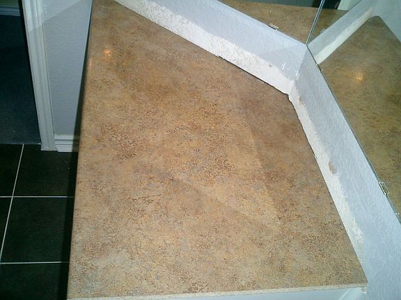 main bathroom new countertop, has a sink