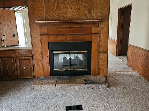 Dining room with see-through fireplace with family room on the opposite side