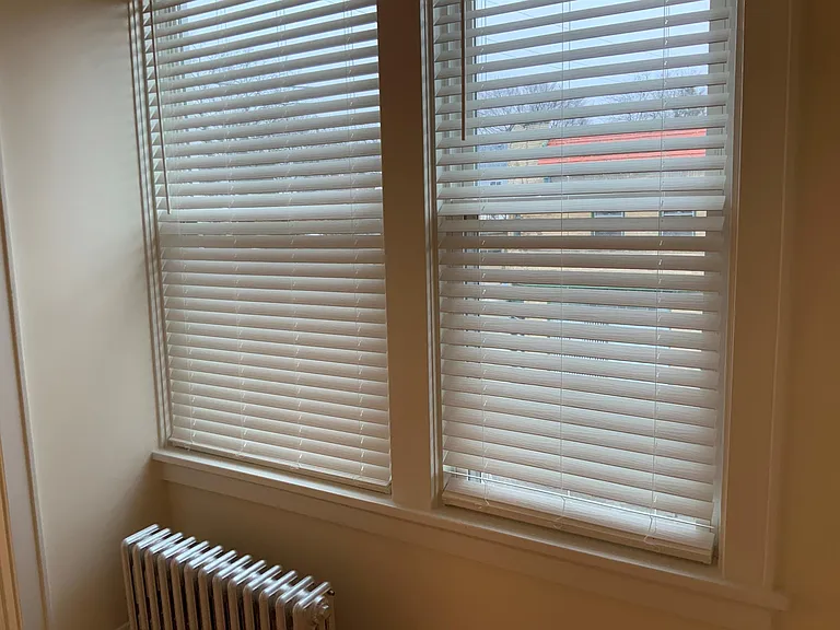 New, neutral colored blinds on living room windows. Same are in the bathroom.
