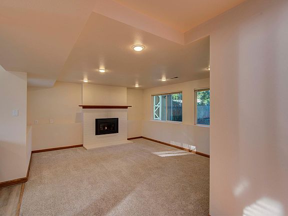 Living room with gas fireplace from hallway