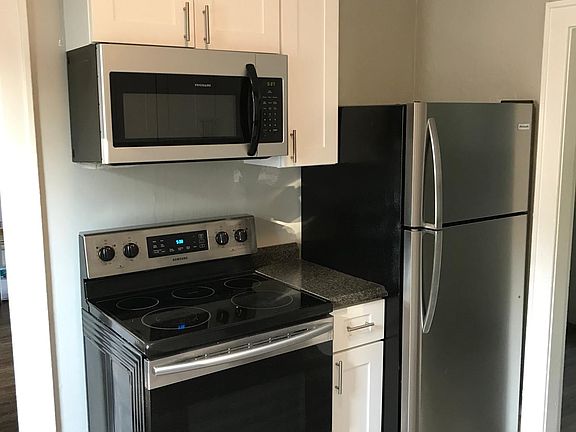 Stainless Steel Appliances - Brand New Refrigerator - 1 YR Old Stove, Microwave , and Dishwasher.