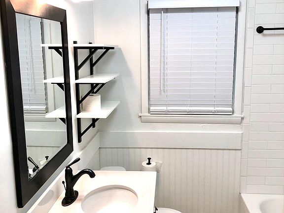 Completely renovated bathroom with farmhouse elements and all new fixtures.