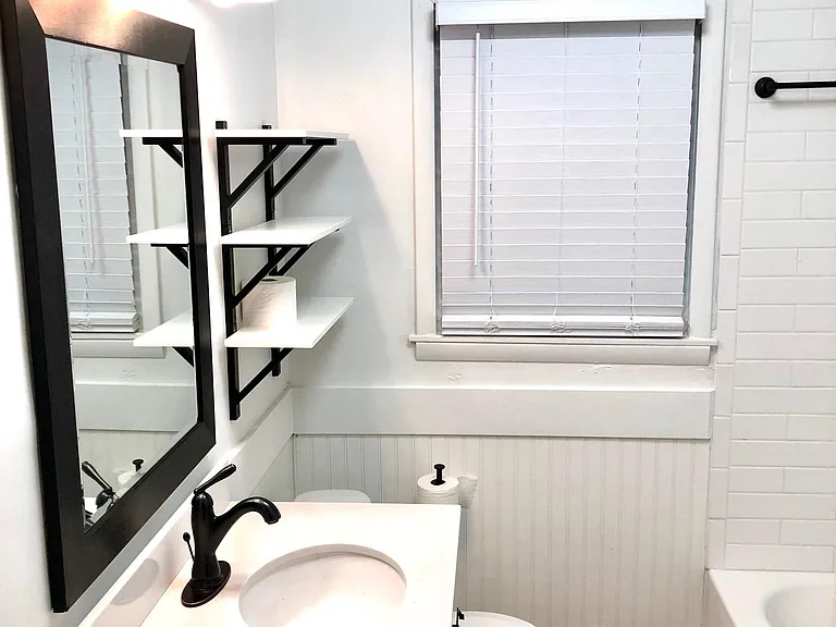 Completely renovated bathroom with farmhouse elements and all new fixtures.