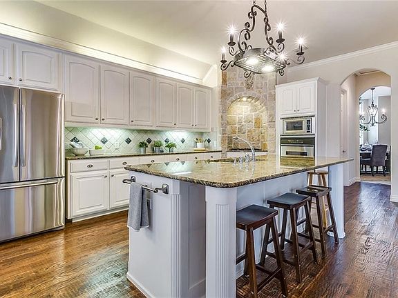 You'll love the gourmet kitchen with granite countertops, stainless steel appliances & a gas cooktop.