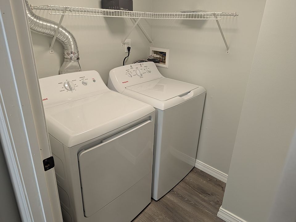 Main level Laundry with Brand New Washer and Dryer. Located off of the kitchen